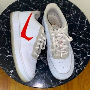 Womens size 7 orange swoosh Nike AF1s. Excellent condition.